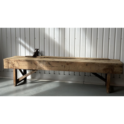 129 - WORK BENCH/TABLE, early 20th century exceptionally long planked pine with enclosed ends, 317cm W x 7... 