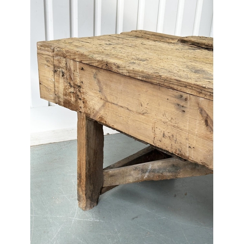 129 - WORK BENCH/TABLE, early 20th century exceptionally long planked pine with enclosed ends, 317cm W x 7... 