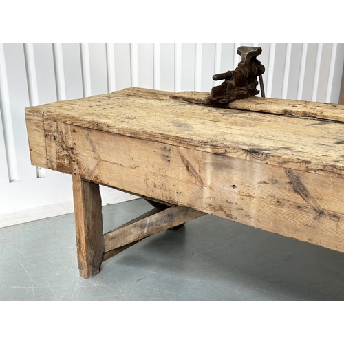 129 - WORK BENCH/TABLE, early 20th century exceptionally long planked pine with enclosed ends, 317cm W x 7... 