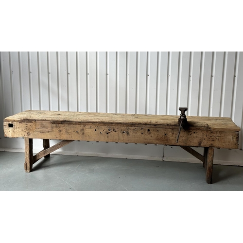 129 - WORK BENCH/TABLE, early 20th century exceptionally long planked pine with enclosed ends, 317cm W x 7... 