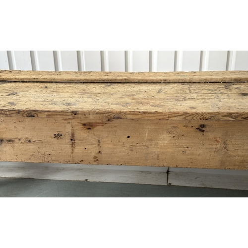 129 - WORK BENCH/TABLE, early 20th century exceptionally long planked pine with enclosed ends, 317cm W x 7... 