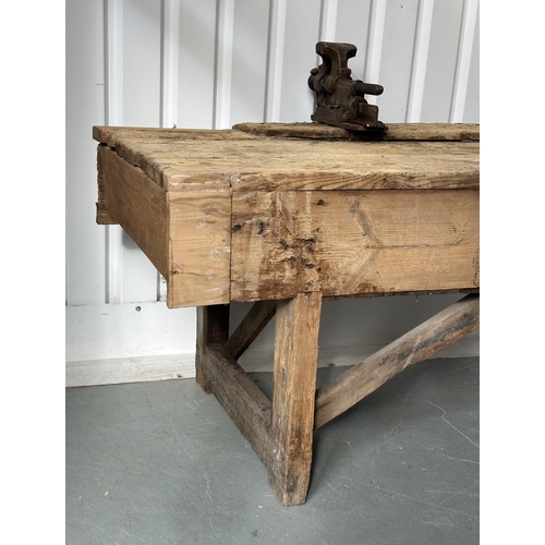 129 - WORK BENCH/TABLE, early 20th century exceptionally long planked pine with enclosed ends, 317cm W x 7... 