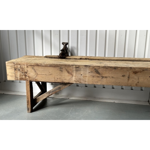 129 - WORK BENCH/TABLE, early 20th century exceptionally long planked pine with enclosed ends, 317cm W x 7... 