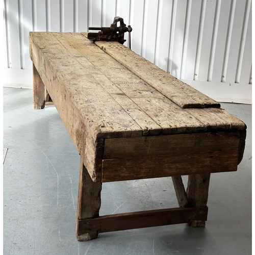 129 - WORK BENCH/TABLE, early 20th century exceptionally long planked pine with enclosed ends, 317cm W x 7... 