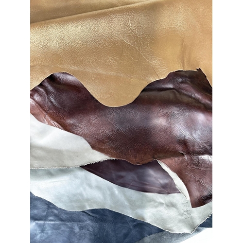 151 - LEATHER HIDES, a selection of seven premium grade full hides in tan brown, black and grey. (7)