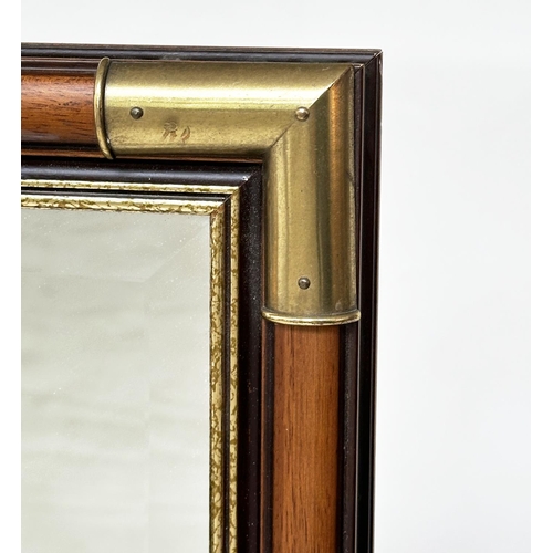 153 - WALL MIRROR, rectangular fruitwood and gilded with bevelled mirror plate and gilt metal corners, 65c... 