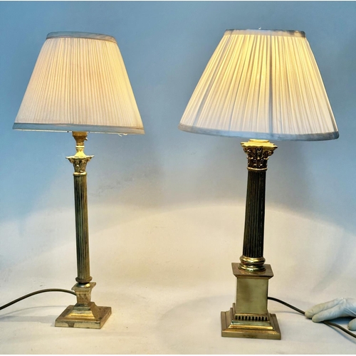 107 - COLUMN TABLE LAMPS, neo classical gilt metal each Corinthian capped with stepped plinth bases and pl... 