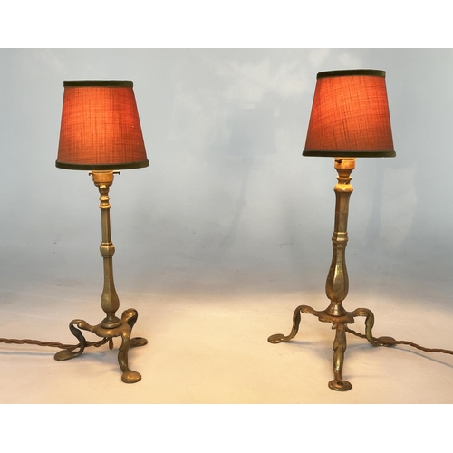 113 - SHIPS TABLE LAMPS, two similar 19th century adapted, each brass, with splayed tripod supports and ma... 