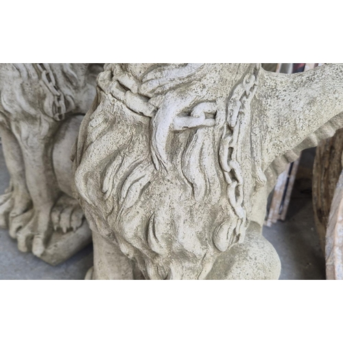 457 - SCULPTURAL GRIFFINS, a pair, composite stone, 77cm H. (2)