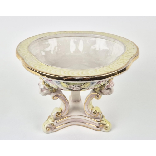 7 - CAPODIMONTE TAZZA, mid century, shaped gilt edge top with mask adorned body on tri-form lion head C-... 