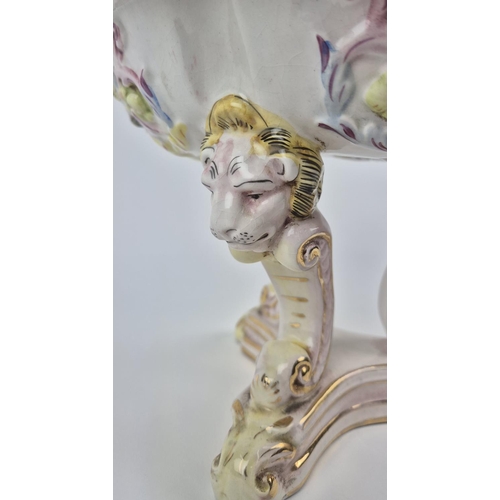 7 - CAPODIMONTE TAZZA, mid century, shaped gilt edge top with mask adorned body on tri-form lion head C-... 