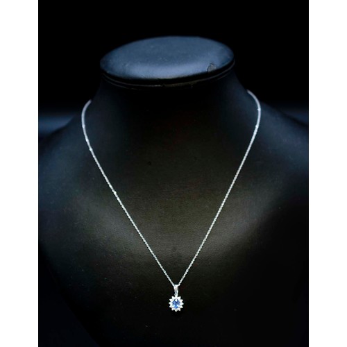 29 - 18CT WHITE GOLD OVAL CORNFLOWER BLUE SAPPHIRE AND RBC DIAMOND PENDANT, on an 18ct white gold chain b... 