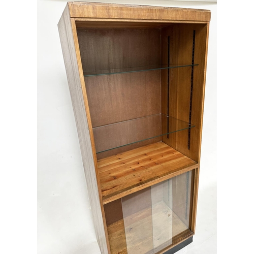 163 - DISPLAY CASE/BOOKCASE, mid 20th century oak with two adjustable glass shelves above a two sliding do... 