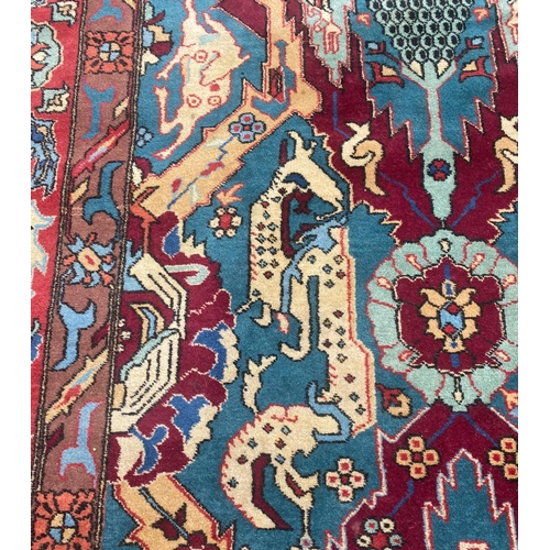 105 - ANTIQUE CAUCASIAN DRAGON DESIGN CARPET, 355cm x 250cm.