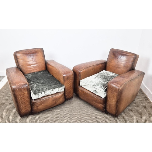 176 - CLUB ARMCHAIRS, a pair, circa 1930, embossed tan leather with green velvet seat cushions and brass c... 