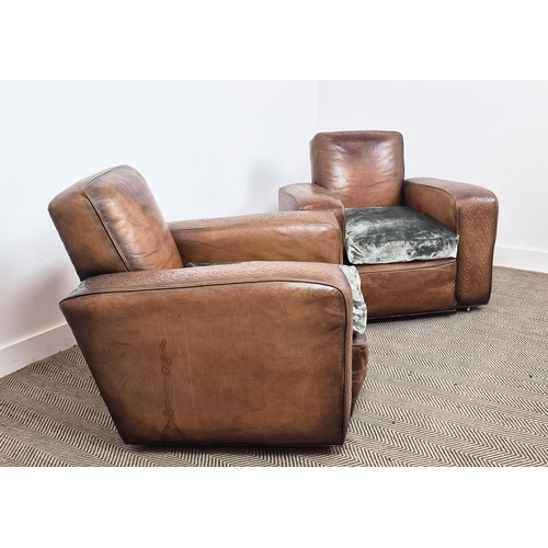 176 - CLUB ARMCHAIRS, a pair, circa 1930, embossed tan leather with green velvet seat cushions and brass c... 