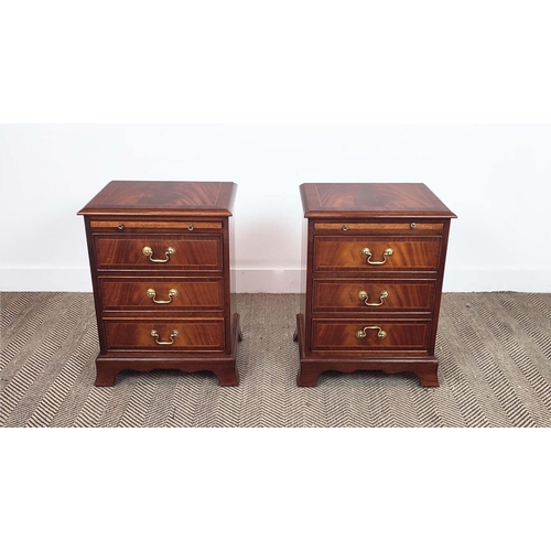 179 - BEDSIDE CHESTS, a pair, Georgian style crossbanded mahogany, each with brushing slide above three dr... 