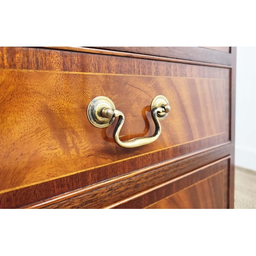 179 - BEDSIDE CHESTS, a pair, Georgian style crossbanded mahogany, each with brushing slide above three dr... 