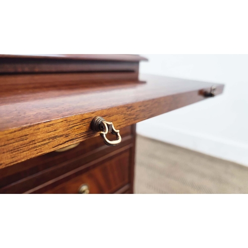 179 - BEDSIDE CHESTS, a pair, Georgian style crossbanded mahogany, each with brushing slide above three dr... 