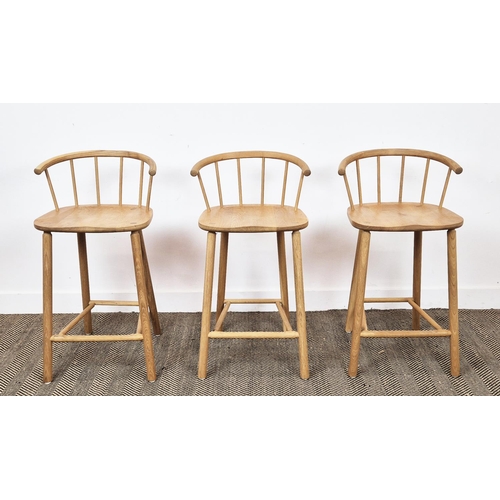 409 - BAR STOOLS, a set of three, light oak with spindle backs, 90cm H x 45cm W x 41cm D. (3)