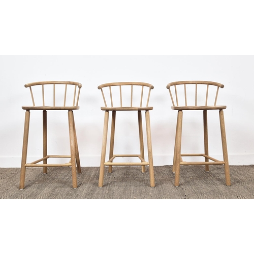 409 - BAR STOOLS, a set of three, light oak with spindle backs, 90cm H x 45cm W x 41cm D. (3)