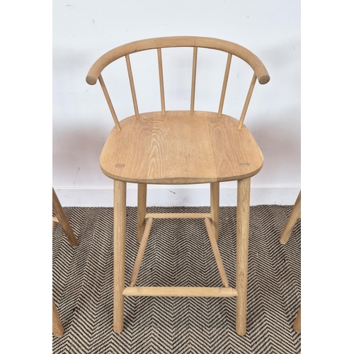 409 - BAR STOOLS, a set of three, light oak with spindle backs, 90cm H x 45cm W x 41cm D. (3)