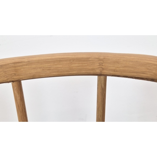 409 - BAR STOOLS, a set of three, light oak with spindle backs, 90cm H x 45cm W x 41cm D. (3)