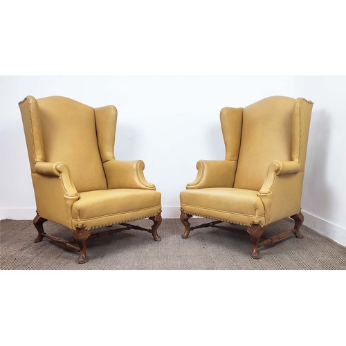 145 - WING ARMCHAIRS, a pair, Georgian style beechwood, in light tan leather, 100cm H x 77cm W. (2)