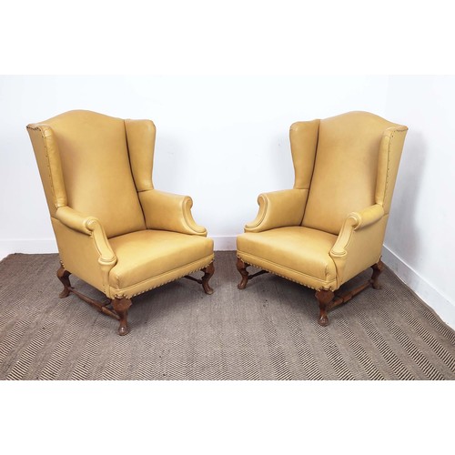 145 - WING ARMCHAIRS, a pair, Georgian style beechwood, in light tan leather, 100cm H x 77cm W. (2)