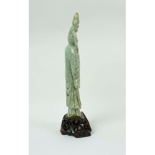 1 - A CHINESE JADEITE FIGURE OF AN IMMORTAL, 19th/20th century, carved holding a lotus leaf, 40cm H.