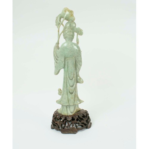 1 - A CHINESE JADEITE FIGURE OF AN IMMORTAL, 19th/20th century, carved holding a lotus leaf, 40cm H.