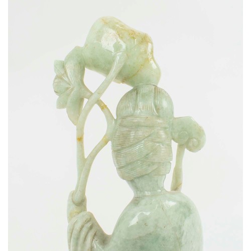 1 - A CHINESE JADEITE FIGURE OF AN IMMORTAL, 19th/20th century, carved holding a lotus leaf, 40cm H.