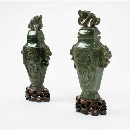 3 - SPINACH JADE LIDDED DRAGON VASES, a pair, with carved dragon detail on carved bases, 28cm H.