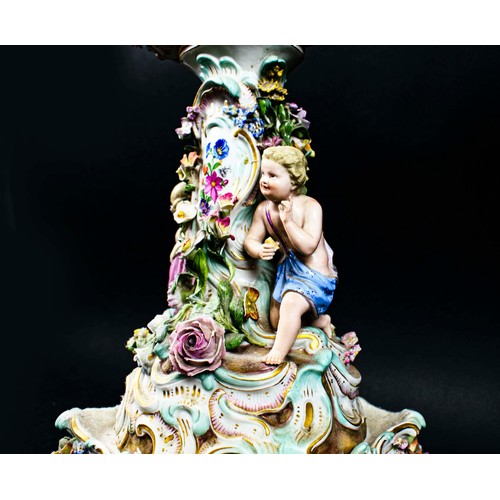 15 - MEISSEN CENTRE PIECE, 19th century comport on stand, with foliate decoration and two putti playing i... 