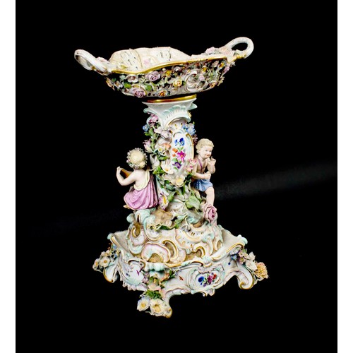 15 - MEISSEN CENTRE PIECE, 19th century comport on stand, with foliate decoration and two putti playing i... 