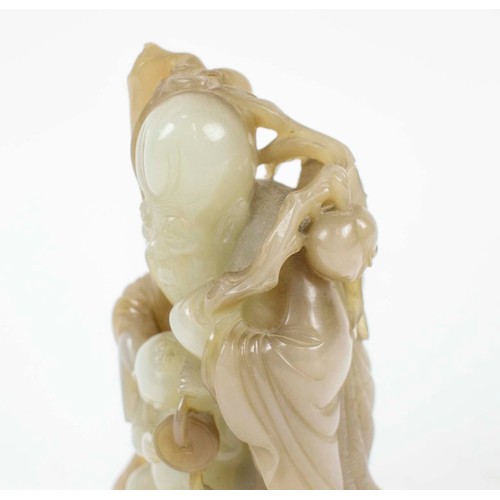 2 - A CHINESE JADE SHOU LAO CARVING, 18th/19th century, with peach vine and boy standing on vessel point... 