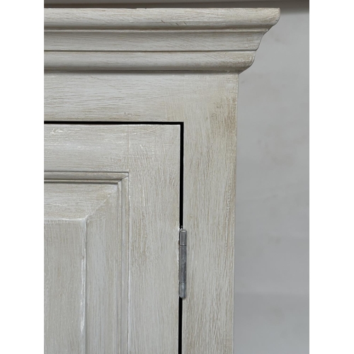 129 - ARMOIRE, French style traditionally grey painted, with twin panelled doors enclosing hanging space a... 