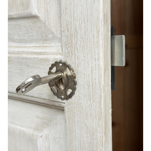 129 - ARMOIRE, French style traditionally grey painted, with twin panelled doors enclosing hanging space a... 