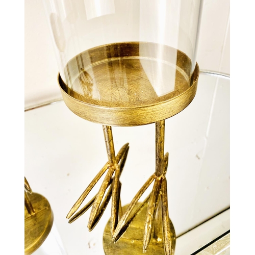 381 - DOMED DISPLAY CASES, a set of three, on gilt metal birds feet stands, 45cm H (3)