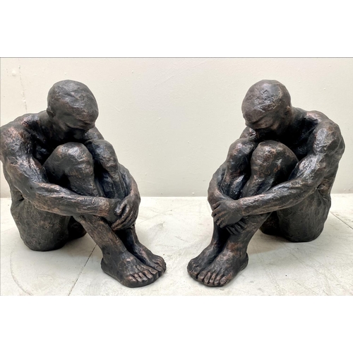 385 - SITTING MAN SCULPTURES, a pair, 34cm H x 21cm x 40cm. (2)