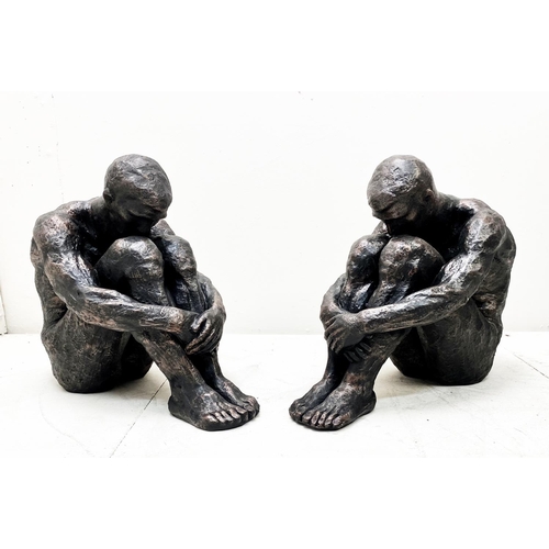 385 - SITTING MAN SCULPTURES, a pair, 34cm H x 21cm x 40cm. (2)