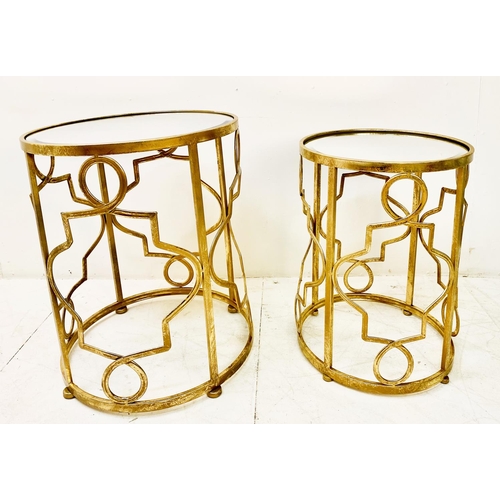 388 - SIDE TABLES, a graduated set of two, gilt metal with circular mirrored tops, larger 56cm H x 46cm. (... 