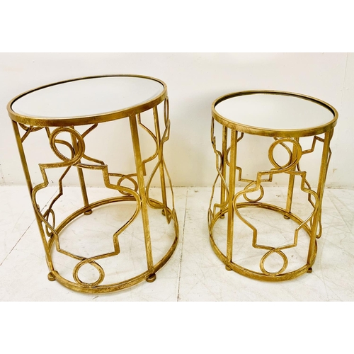 388 - SIDE TABLES, a graduated set of two, gilt metal with circular mirrored tops, larger 56cm H x 46cm. (... 