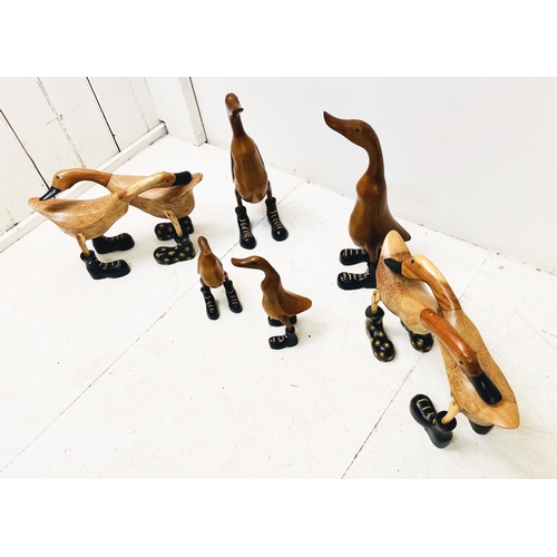 389 - WOODEN DUCKS, a collection, various poses, wearing boots. (6 individual pieces/8 ducks) Largest 44cm... 