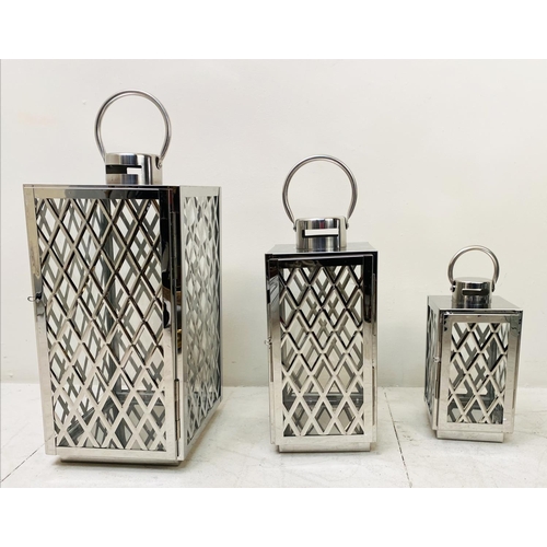 395 - LANTERNS, a graduated set of three, polished metal with lattice design, largest 45cm H x 23cm x 23cm... 