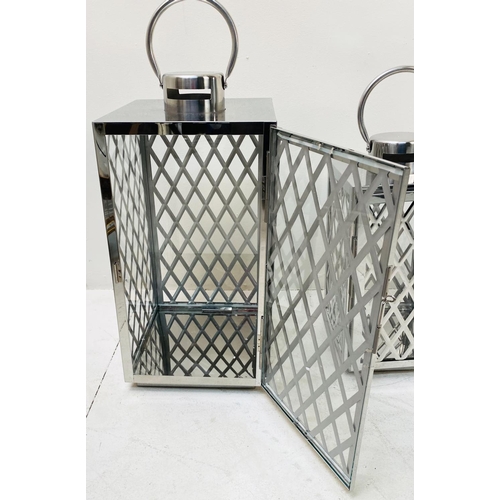 395 - LANTERNS, a graduated set of three, polished metal with lattice design, largest 45cm H x 23cm x 23cm... 