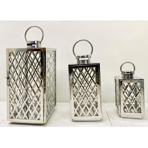 395 - LANTERNS, a graduated set of three, polished metal with lattice design, largest 45cm H x 23cm x 23cm... 