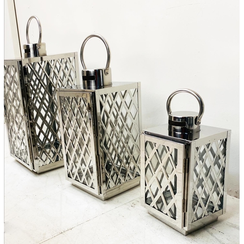 395 - LANTERNS, a graduated set of three, polished metal with lattice design, largest 45cm H x 23cm x 23cm... 