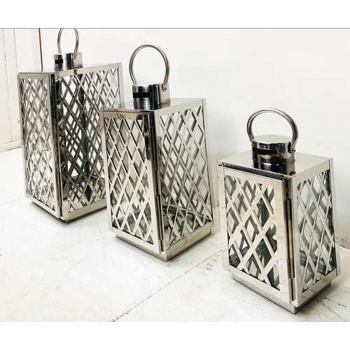 395 - LANTERNS, a graduated set of three, polished metal with lattice design, largest 45cm H x 23cm x 23cm... 