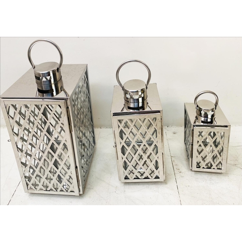 395 - LANTERNS, a graduated set of three, polished metal with lattice design, largest 45cm H x 23cm x 23cm... 